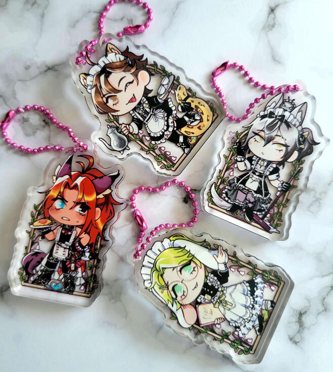 Nu Carnival Thick Acrylic Standees photograph of four thick acrylic keychains / standees. the standees are characters from nu carnival in maid outfits. characters include eiden dante rei and olivine