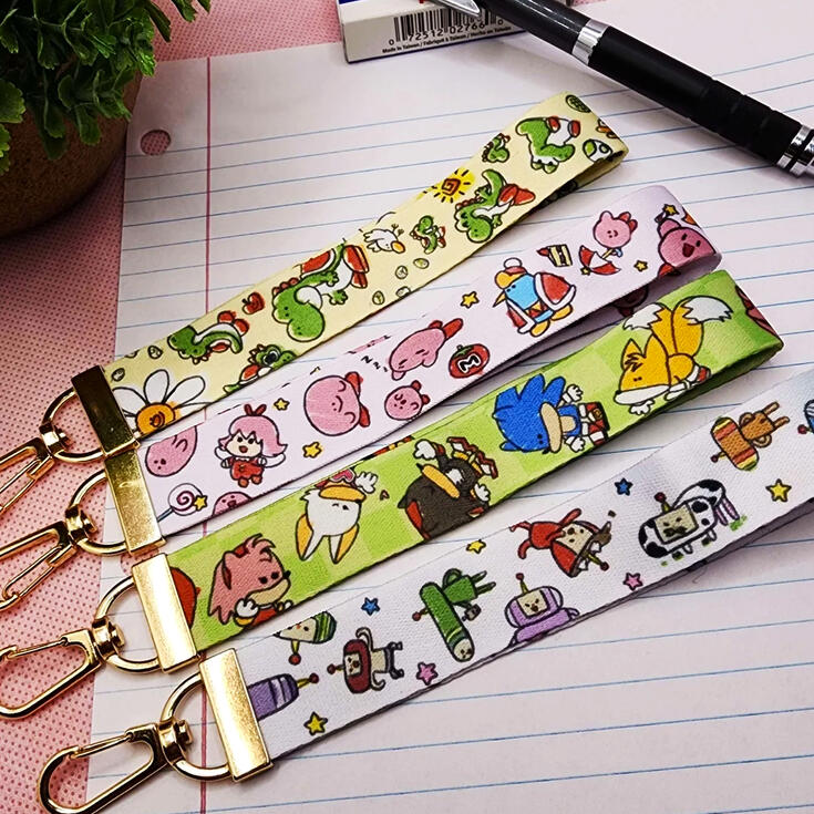 Doodle Video Game Lanyards photograph of wrist lanyards with varying doodle esque video game designs: games included yoshi kirby sonic and katamari